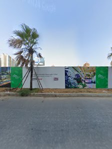 The image shows a construction site or development area in Thao Dien, Saigon with green banners and artwork on the fence.