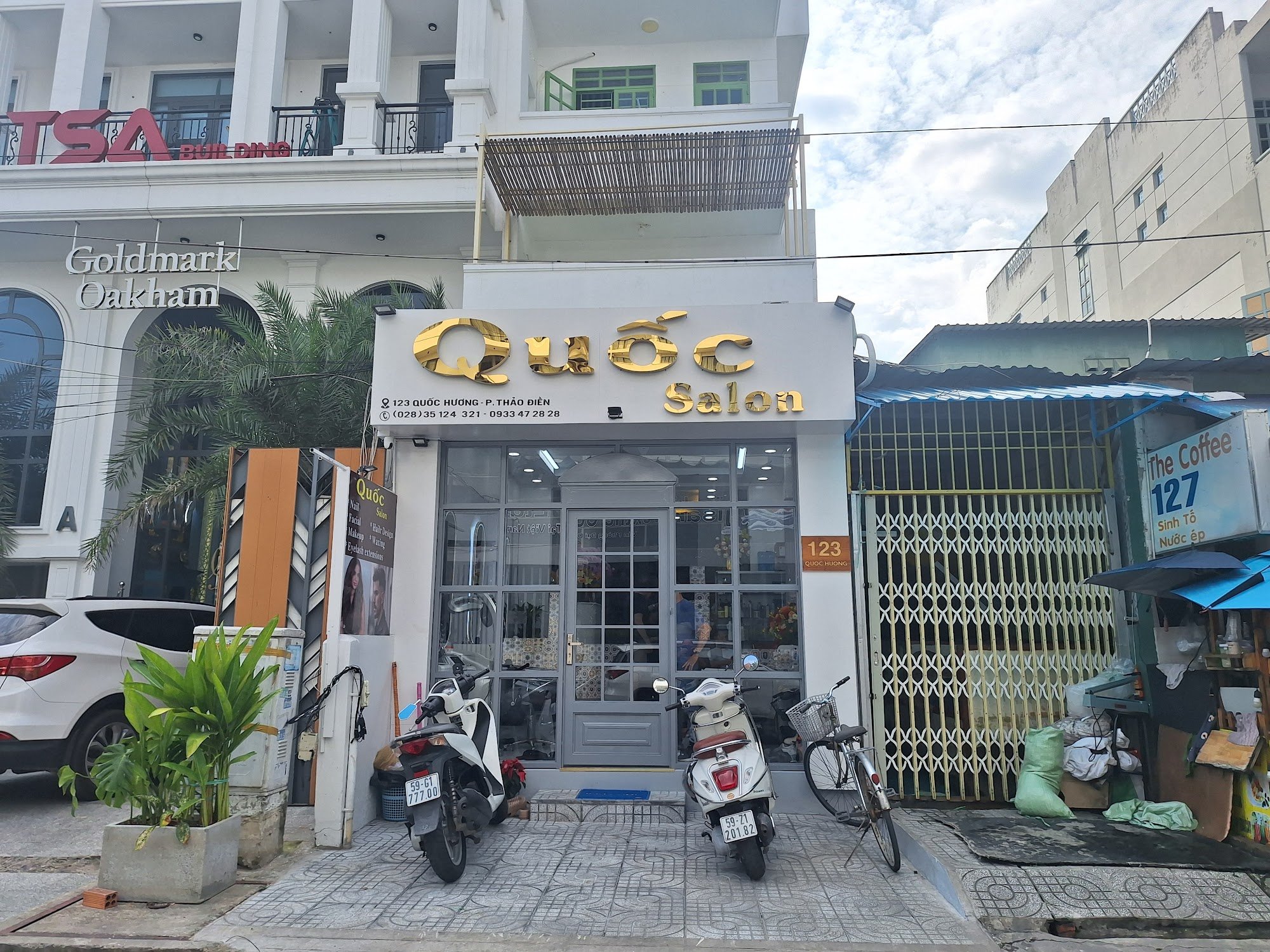 The image shows an exterior view of a salon named 'Quốc Salon' located at address 123 Quoc Huong, Phu Thao Dien in Saigon.