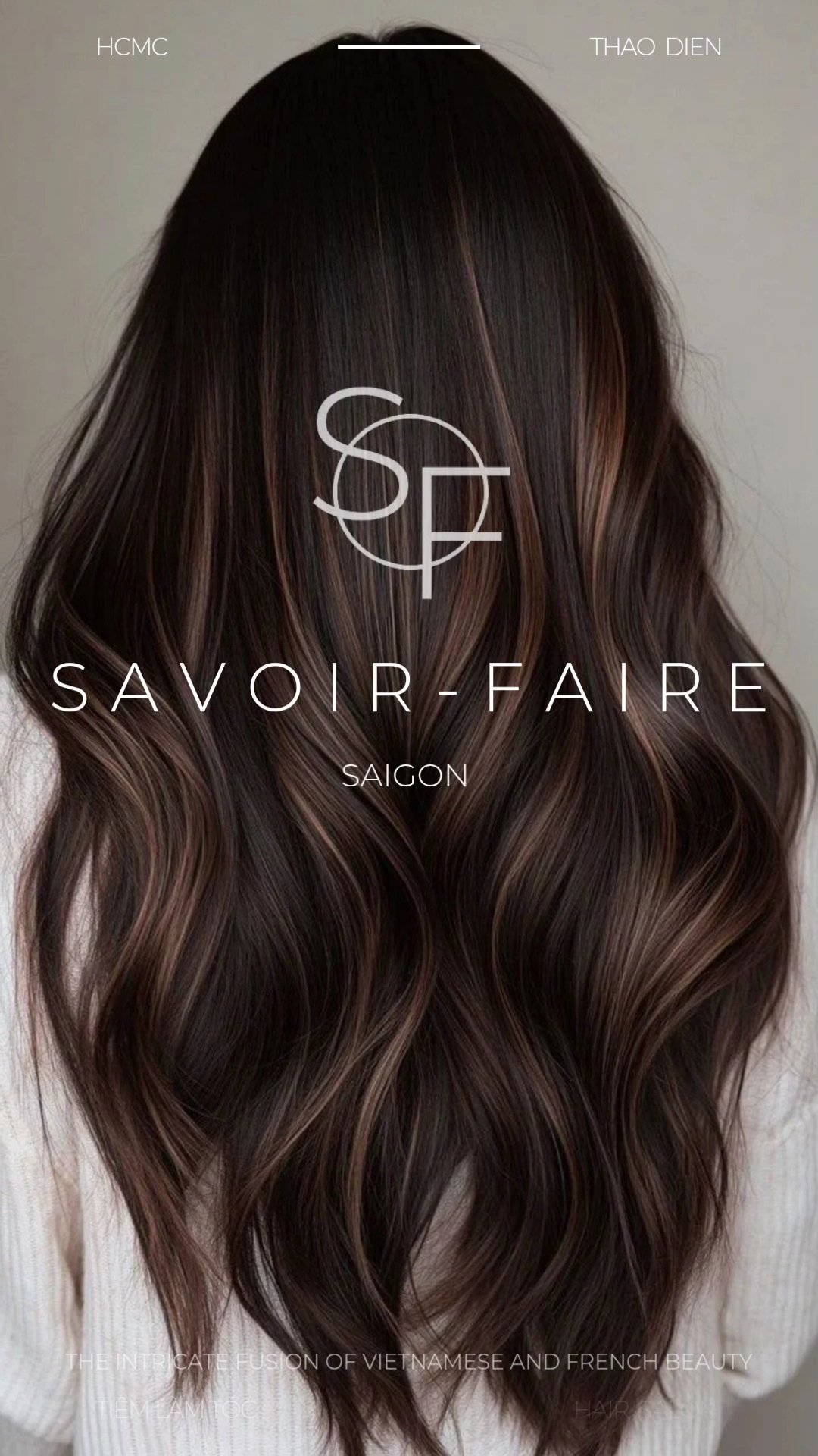 The image displays a close-up of someone's hair styled in waves and highlights, with the text 'SAVOIR-FAIRE SAIGON' prominently featured over it. The 