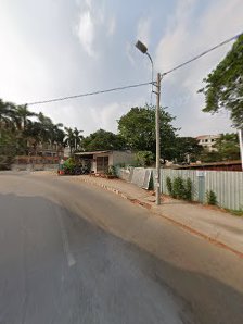The image shows a street view in Thao Dien, Saigon. There is an empty road with trees and buildings on the sides.