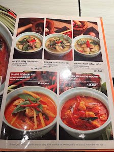 The image shows a menu from Thao Dien, Saigon featuring various dishes such as Tom Yam Goong and other Thai cuisine items.