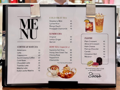 A menu board displaying various food and drink options at a venue in Thao Dien, Saigon.