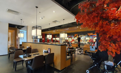 The image depicts an interior view of a modern restaurant or dining establishment in Thao Dien, Saigon. The space is well-lit with contemporary lighti