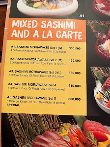 The image is a menu from a venue in Thao Dien, Saigon, showcasing "MIXED SASHIMI AND A LA CARTE" with various sashimi options (A1 to A5) and their pri