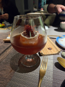 A close-up of a cocktail served in an elegant glass on a table at Thao Dien, Saigon.