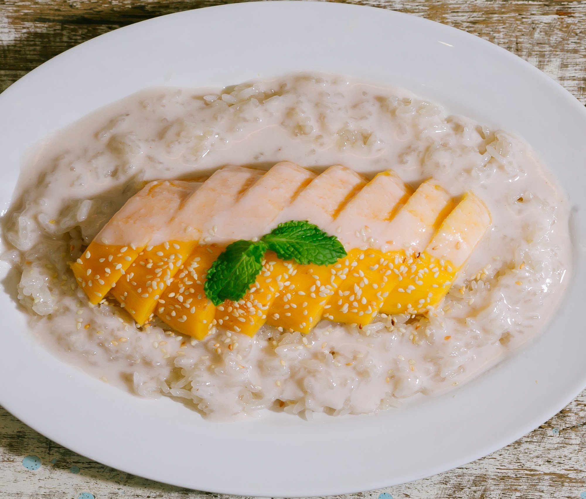 Mango Congee with Sesame Seeds