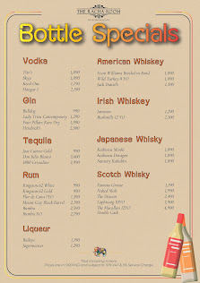 A menu titled 'Bottle Specials' listing alcoholic beverages categorized into Vodkas, Gin, Tequila, Rum, Liquor, American Whiskey, Irish Whiskey, Japan
