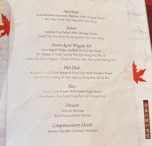 A menu from a restaurant in Thao Dien, Saigon, featuring sections like Appetizer, Miso, Sake-Steamed Wagyu Beef, Hot Dish, Rice, Dessert, and Complime