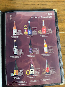 A menu page displaying various alcoholic beverages from Japan in a restaurant setting.