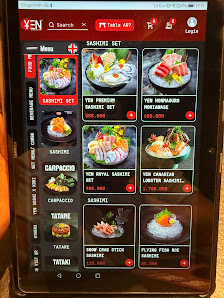 A tablet displaying a food menu from 'YEN' restaurant in Thao Dien, Saigon.
