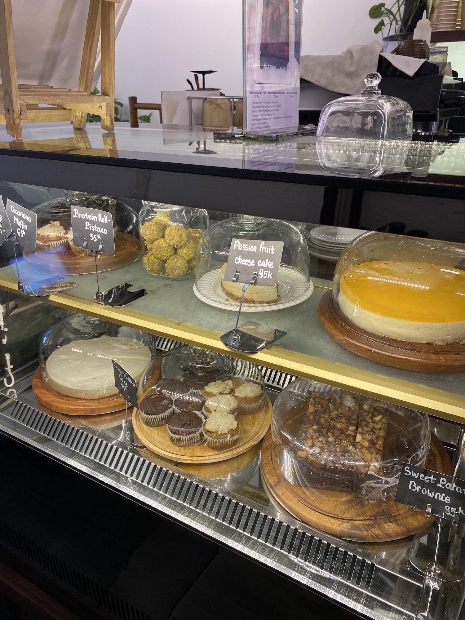 A variety of desserts including cheesecakes, mousse cakes, and brownies